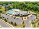 Stunning aerial view of the community pool, clubhouse, and amenities with ample parking at 822 Flatwater Ct, Fort Mill, SC 29708