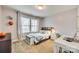 Well-lit bedroom with a desk, closet, and decor at 822 Flatwater Ct, Fort Mill, SC 29708