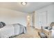 Bedroom with neutral walls and comfortable sitting area at 822 Flatwater Ct, Fort Mill, SC 29708
