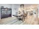 Spacious dining room adjacent to the kitchen features a stylish chandelier and convenient access to the bar area at 822 Flatwater Ct, Fort Mill, SC 29708