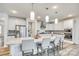 Modern kitchen with stainless steel appliances, white cabinets, and granite countertops at 822 Flatwater Ct, Fort Mill, SC 29708
