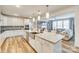 Open-concept kitchen with an island, stainless steel appliances and a view into the living room at 822 Flatwater Ct, Fort Mill, SC 29708