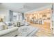 This well-lit living space flows into the kitchen and features comfortable seating and natural lighting at 822 Flatwater Ct, Fort Mill, SC 29708