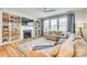 Inviting living room with fireplace, custom built-ins, lots of natural light, and comfortable seating at 822 Flatwater Ct, Fort Mill, SC 29708