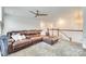 Upstairs loft features comfortable seating, a ceiling fan, and access to other rooms in the house at 822 Flatwater Ct, Fort Mill, SC 29708