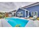 Swimming pool in a backyard with lounge chairs at 822 Flatwater Ct, Fort Mill, SC 29708