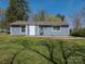 Charming single-story home with a well-maintained front yard, new siding, and mature trees at 8432 Strider Dr, Charlotte, NC 28212