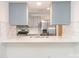 Modern kitchen with stainless steel appliances and a bright white marble backsplash at 8432 Strider Dr, Charlotte, NC 28212