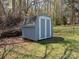 Well-maintained backyard storage shed with double doors, providing ample space for tools and equipment at 8432 Strider Dr, Charlotte, NC 28212