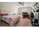 Spacious bedroom with carpet floor, an attached desk, and a ceiling fan at 9610 Pensive Ln, Waxhaw, NC 28173
