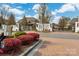 Elegant gated community entrance with brick accents, lush landscaping, and secure access at 9610 Pensive Ln, Waxhaw, NC 28173