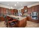 Modern kitchen with stainless steel appliances, a center island with seating, and stylish cabinetry at 9610 Pensive Ln, Waxhaw, NC 28173
