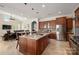 Expansive kitchen featuring a large center island, stainless steel appliances, and ample cabinet space at 9610 Pensive Ln, Waxhaw, NC 28173