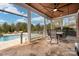 View of an outdoor patio featuring a dining table set and the pool area at 9610 Pensive Ln, Waxhaw, NC 28173