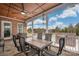 View of an outdoor patio featuring a dining table set with a view of the pool at 9610 Pensive Ln, Waxhaw, NC 28173