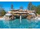 Stunning pool features a captivating rock waterfall, creating a serene and luxurious backyard oasis at 9610 Pensive Ln, Waxhaw, NC 28173