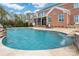 Backyard pool with a waterfall feature, patio area, and a well-maintained lawn at 9610 Pensive Ln, Waxhaw, NC 28173