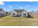 Well maintained backyard with a small patio area perfect for outdoor dining at 103 Karlyn Ct, Mooresville, NC 28115