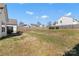 Expansive backyard with a well-maintained lawn and wooden fence, offering plenty of space at 103 Karlyn Ct, Mooresville, NC 28115