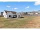 Large backyard featuring a patio area, and surrounded by a wooden fence for privacy at 103 Karlyn Ct, Mooresville, NC 28115
