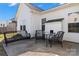 Exterior view of a patio with wicker furniture set, perfect for enjoying the outdoors at 103 Karlyn Ct, Mooresville, NC 28115