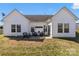 Exterior view of a patio with wicker furniture, perfect for outdoor entertaining at 103 Karlyn Ct, Mooresville, NC 28115