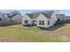 Backyard featuring a small patio area perfect for outdoor dining at 103 Karlyn Ct, Mooresville, NC 28115