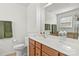 Well-lit bathroom with vanity, toilet, and a large mirror reflecting the space at 103 Karlyn Ct, Mooresville, NC 28115