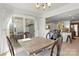 Bright dining area with sliding glass doors leading to the backyard patio at 103 Karlyn Ct, Mooresville, NC 28115