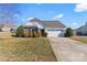 Attractive single-story home boasting lush landscaping, stone accents, and a convenient two-car garage at 103 Karlyn Ct, Mooresville, NC 28115
