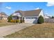 Beautiful home featuring a well-maintained lawn and a two-car garage with extra space at 103 Karlyn Ct, Mooresville, NC 28115