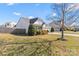 Charming home with a well-manicured lawn, mature landscaping, and a two-car garage at 103 Karlyn Ct, Mooresville, NC 28115