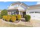 Inviting single-story home with stone accents, manicured landscaping, and attached two-car garage at 103 Karlyn Ct, Mooresville, NC 28115