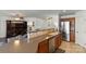 Modern kitchen featuring stainless steel appliances, ample countertop space, and a seamless flow to the living room, ideal for entertaining at 103 Karlyn Ct, Mooresville, NC 28115