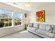 Sitting room showcasing bright windows, comfortable couch, and colorful artwork at 103 Karlyn Ct, Mooresville, NC 28115