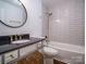 Stylish bathroom with black granite counter, subway tile, and modern fixtures at 105 Timber Ridge Rd, Belmont, NC 28012