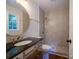 Updated bathroom features a round mirror, granite counters, and tiled shower at 105 Timber Ridge Rd, Belmont, NC 28012