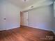 Bedroom featuring hardwood floors, white trim, neutral walls, and ample space at 105 Timber Ridge Rd, Belmont, NC 28012