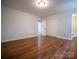 Open bedroom space with hardwood floors, closet, and recessed lighting at 105 Timber Ridge Rd, Belmont, NC 28012