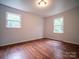 Cozy bedroom with wood floors, natural light, and neutral walls create a serene space at 105 Timber Ridge Rd, Belmont, NC 28012