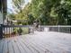 Wood deck with wood railings overlooking backyard, with privacy and mature trees at 105 Timber Ridge Rd, Belmont, NC 28012