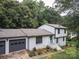 Charming two-story home with a gray roof, gray accents, and a bright blue front door at 105 Timber Ridge Rd, Belmont, NC 28012