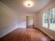 Open living room filled with natural light, hardwood floors, and neutral walls at 105 Timber Ridge Rd, Belmont, NC 28012