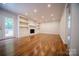 Spacious living room features hardwood floors, fireplace and built-in shelves at 105 Timber Ridge Rd, Belmont, NC 28012