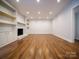 Inviting living room features hardwood floors, recessed lighting, and a cozy fireplace at 105 Timber Ridge Rd, Belmont, NC 28012