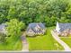 Beautiful aerial view of a brick two-story home with a long driveway and well-manicured lawn at 1102 High Brook Dr, Waxhaw, NC 28173