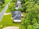 Aerial view of the backyard, deck, fence, and manicured lawn of this lovely home at 1102 High Brook Dr, Waxhaw, NC 28173