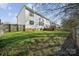 The home has a large grassy backyard and wood deck at 1102 High Brook Dr, Waxhaw, NC 28173