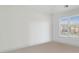 Simple bedroom featuring neutral carpet, white walls, and a window for natural light at 1102 High Brook Dr, Waxhaw, NC 28173