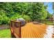 Spacious wooden deck with a grill and lounge chairs, perfect for outdoor relaxation and entertainment at 1102 High Brook Dr, Waxhaw, NC 28173